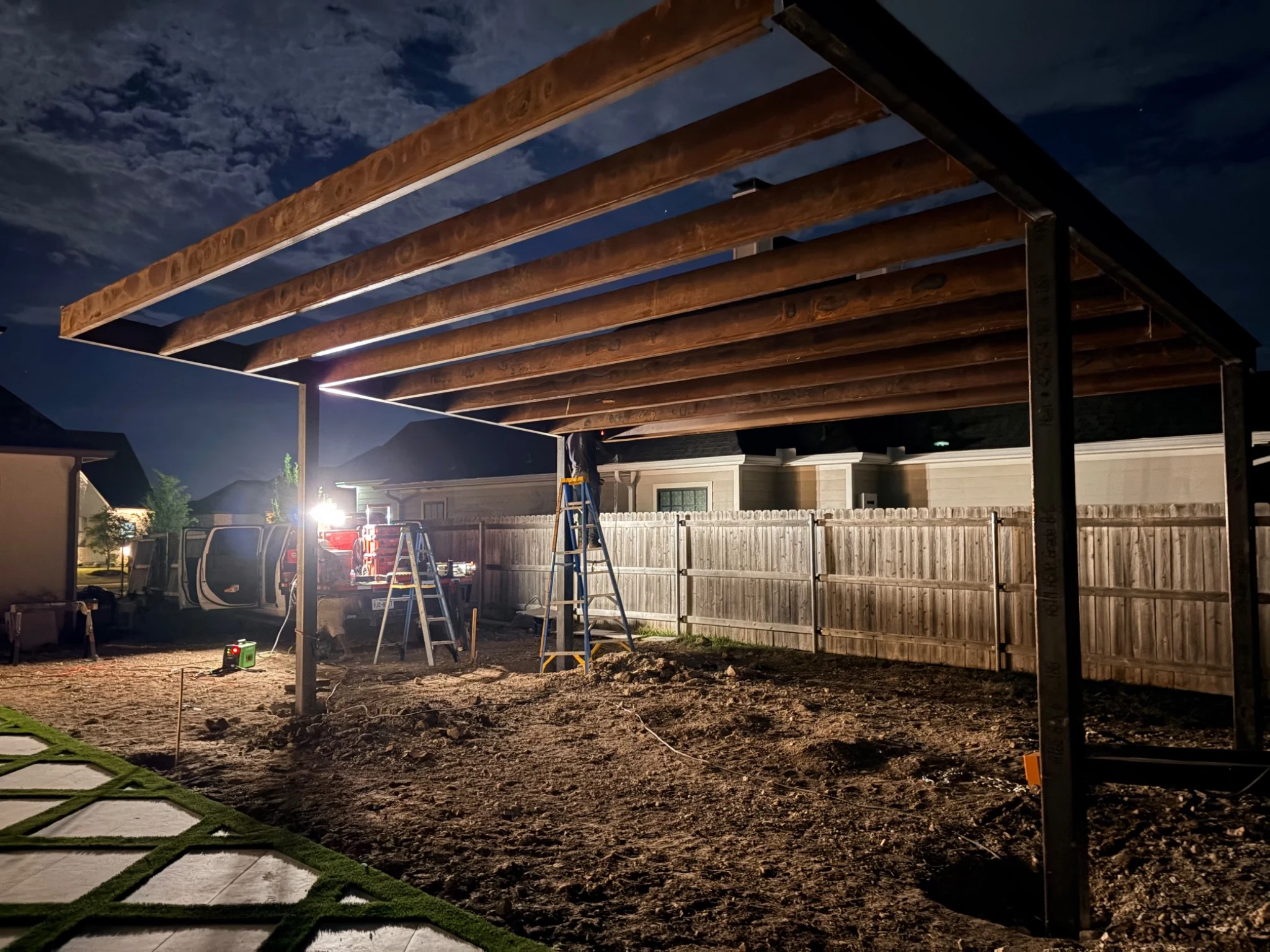 Company-supplied cantilever patio-cover frame photographed during installation
